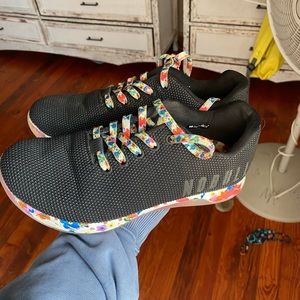 Gently used black daisy trainers